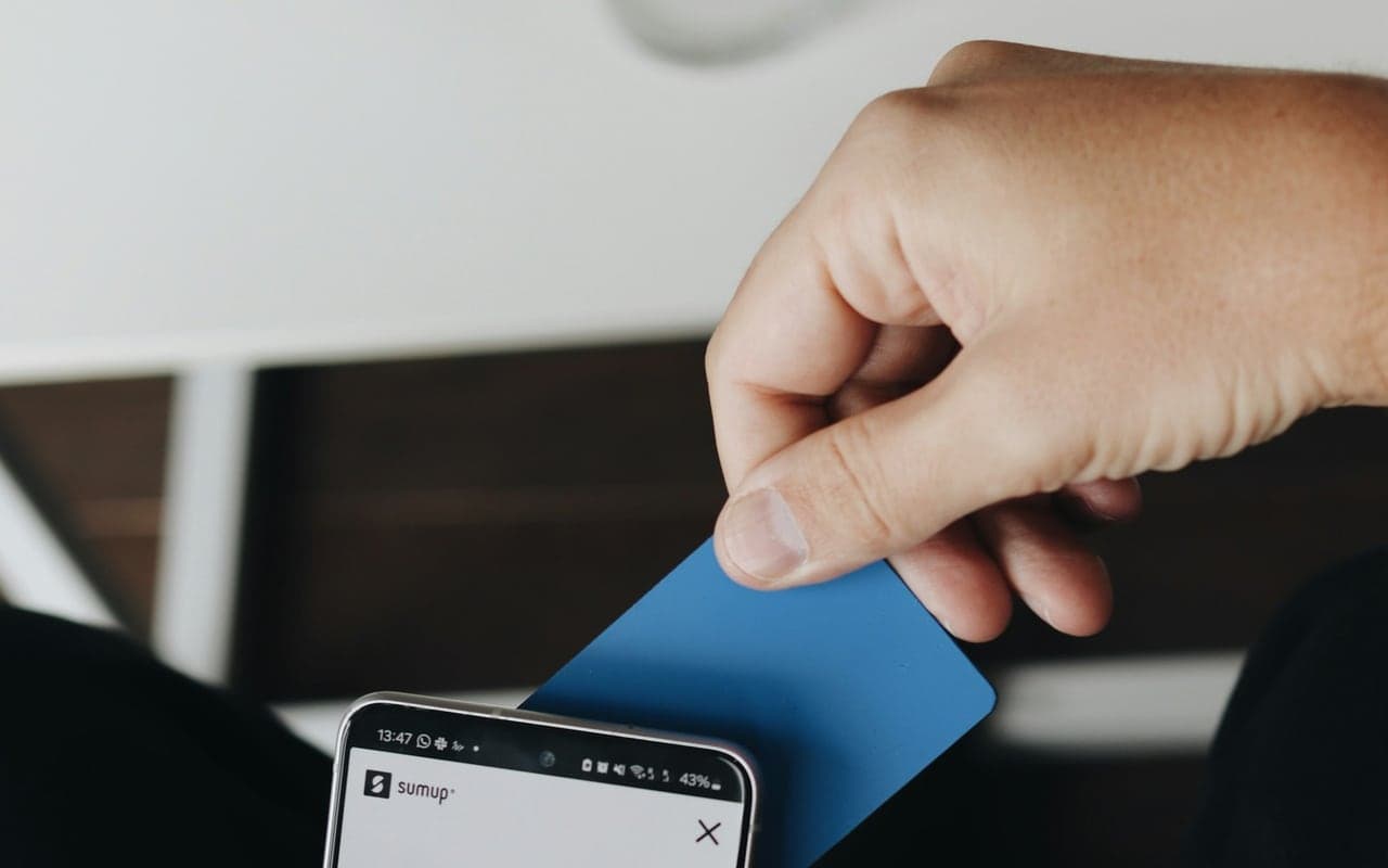 Person using a smartphone for a contactless digital wallet action